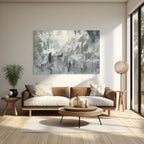 Modern living room with a brown sofa, round coffee table, and abstract painting on the wall.