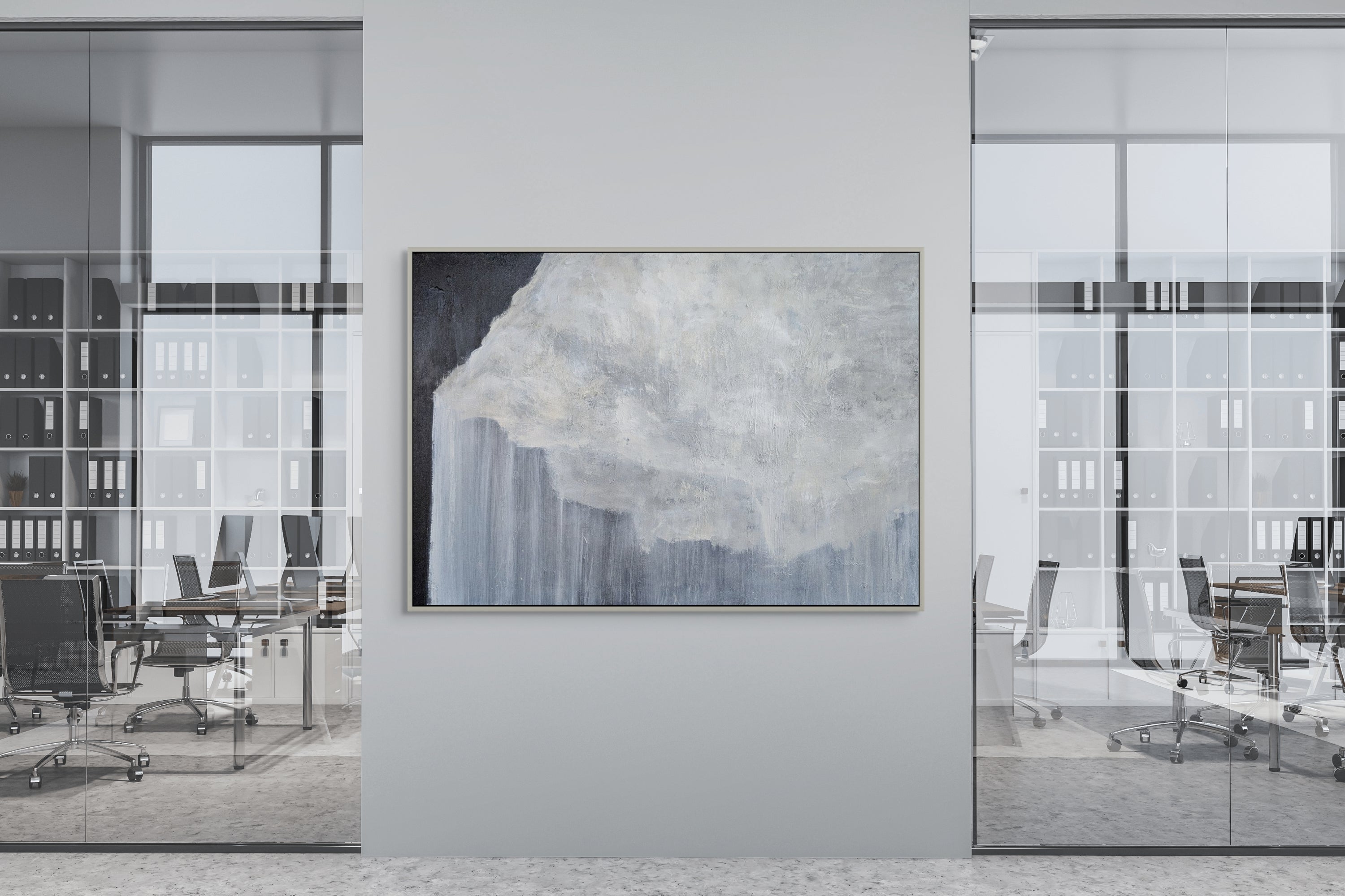Modern office interior with a large abstract painting on a wall.