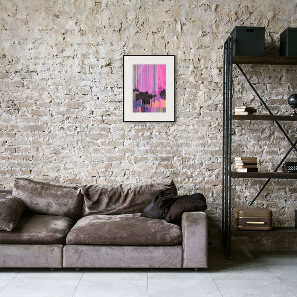 a modern living room with a gray sofa, a brick wall, and a framed abstract art piece hanging above it.